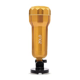 The Zolo Vibrating Personal Trainer is a gold, trophy-like cylindrical stroker featuring a geometric texture and adjustable suction cup for hands-free use. The word ZOLO appears in white on the side, and it includes a realistic textured canal inside. USB rechargeable, its perfect for solo sessions.