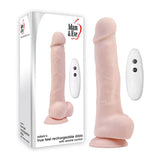 The image displays the Adam & Eve Adams True Feel Rechargeable Dildo in realistic flesh tone with a textured surface, alongside a white remote control with two buttons. The packaging features matching imagery and prominently displays the Adam & Eve logo and product name.