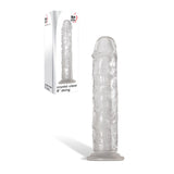 An Adam & Eve Crystal Clear 8 Dong, featuring a transparent textured silicone with a lifelike phallic shape, stands upright with a suction cup base. The packaging in the background is white with minimalist design elements and the brand logo at the top, displaying its image and product name.