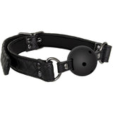 The Adam & Eve Eves Fetish Dreams Ball Gag is a black mouth restraint featuring vegan leather straps, metal hardware, and a breathable ball with small ventilation holes. It offers an adjustable fit with buckle fastenings on both sides connected by metal rings to the ball.