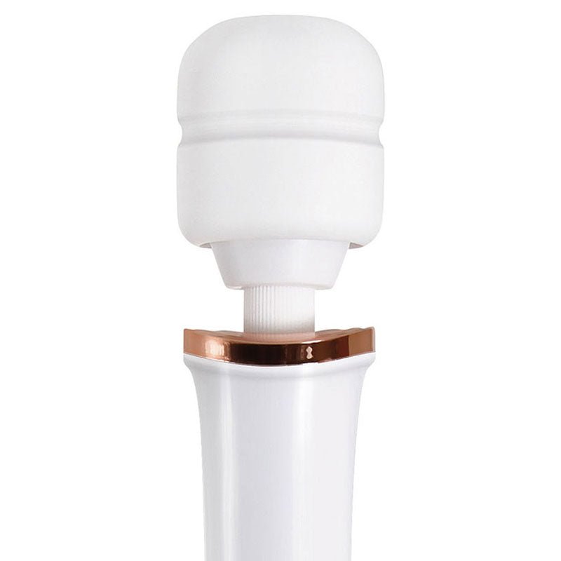 The Adam & Eve Rechargeable Magic Massager in rose gold and white features a large, round silicone head and a slim handle accented with a metallic band. Designed for personal use, it offers vibration functions and boasts a sleek, minimalist design.