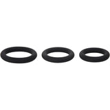 Three black silicone O-rings from the Adam & Eve Silicone Penis Ring Set are aligned horizontally against a white background. These smooth and uniformly shaped rings decrease in size from left to right, designed for comfortable fit and erection prolongation.