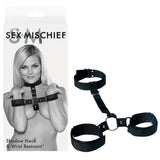 The Sex & Mischief Shadow Neck and Wrist Restraint - Black Restraints is shown in a grayscale image on the packaging, featuring a person with raised hands wearing the restraint. The adjustable collar and cuffs are linked by black fabric, making it ideal for BDSM beginners.