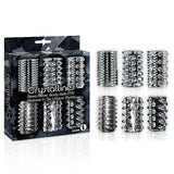 The 9s Crystalline TPR Cock Sleeves set includes six transparent, stretchable sleeves, each showcasing unique textures like spikes, ridges, and studs for enhanced sensations. The box features a dark geometric design.